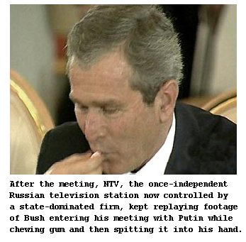 Bush at Russian Nuclear Missile Treaty Signing, spitting out his gum... in his hand.